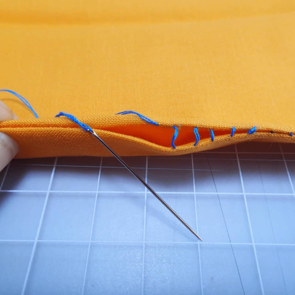Close up of the open stitches of an invisible ladder stitch. Video shows how to sew them and pull them tight.
