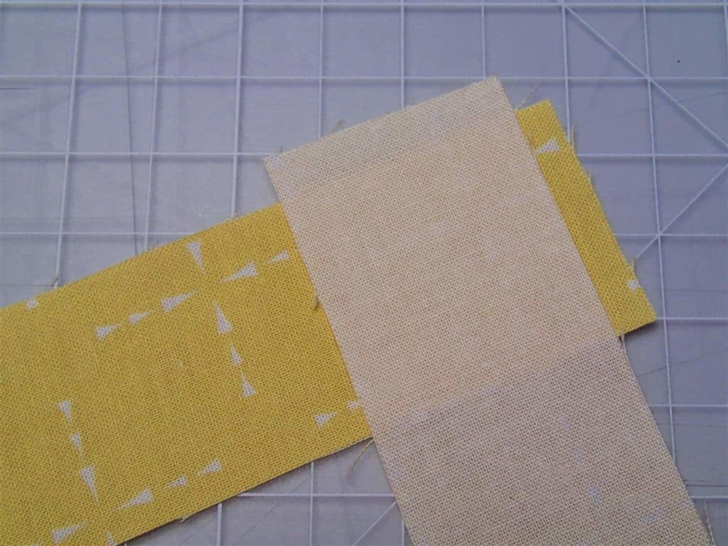 Binding pieces placed right sides together at right angles