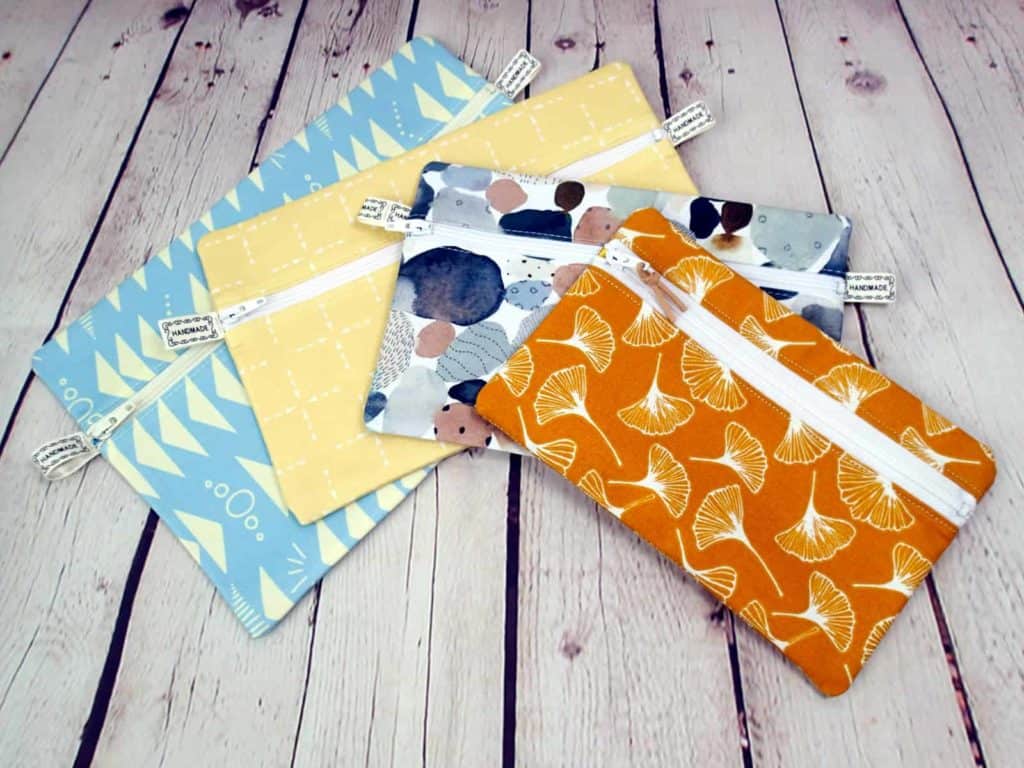 4 easy to sew zipper pouches, image comparing the size of the finished zipper bags from one sewing pattern