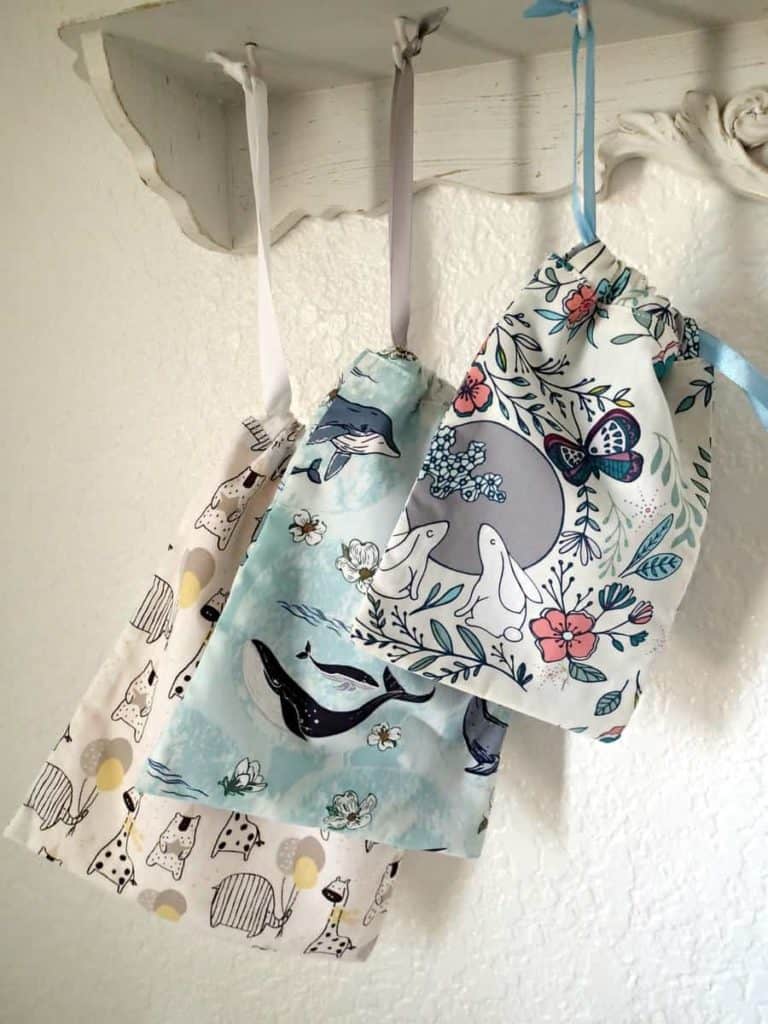 Dorset drawstring bags sewing pattern. A set of three very easy to sew drawstring bags which are ideal for beginners learning to sew. Step by step photo instructions. These bags are scrap friendly and ideal to use as gift bags and storage ideas to sew. Easy bag to sew for beginners. SewSimpleBags